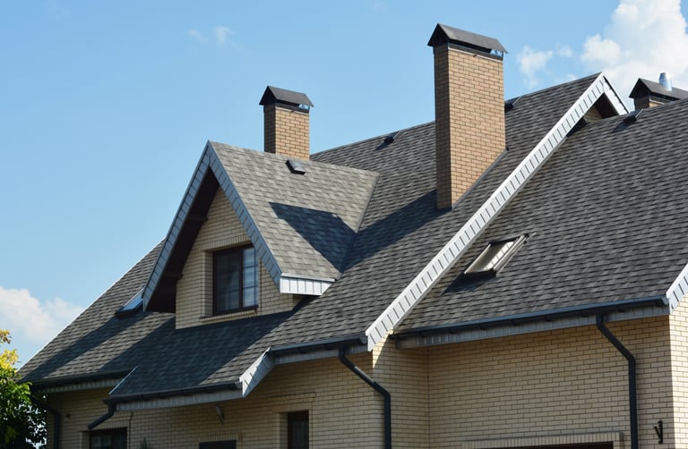Asphalt shingle roof with gutters